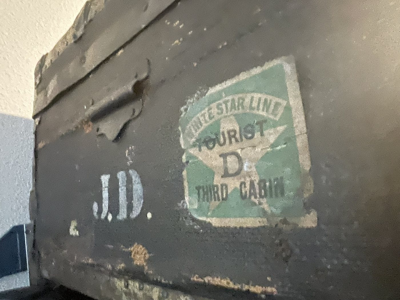 A trunk side showing the painted initials J.D. beside a White Star Line Tourist Third Cabin label